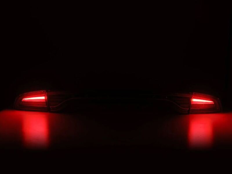 AlphaRex NOVA-Series prismatic LED tail lights for 2015-2023 Dodge Charger in smoke finish, showcasing a sleek design.