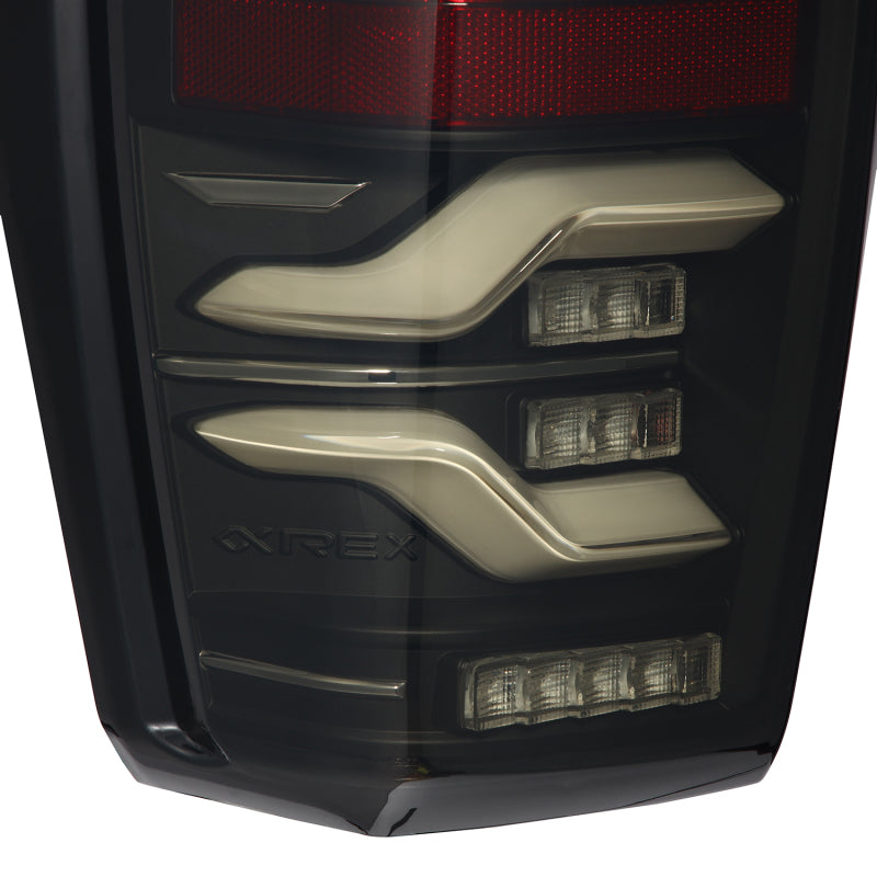 AlphaRex LUXX LED taillights for 16-21 Toyota Tacoma in black with sequential signal and activation light features.