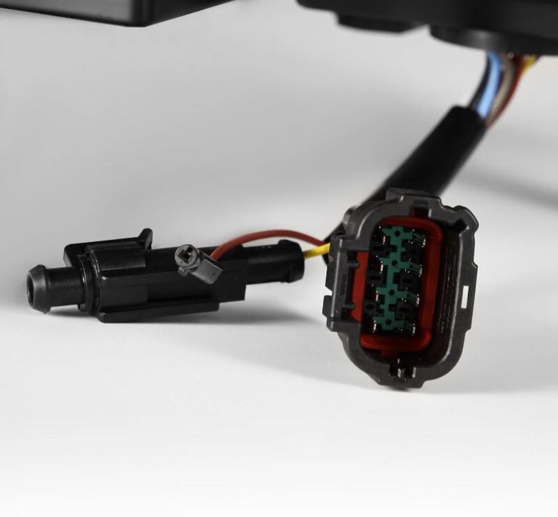 AlphaRex NOVA-Series LED projector headlights for 09-24 Nissan GT-R, showcasing a detailed wiring connector.