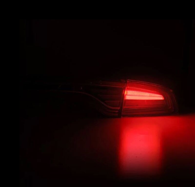 AlphaRex NOVA-Series prismatic LED tail lights for 2015-2023 Dodge Charger in smoke finish, showcasing a sleek design.