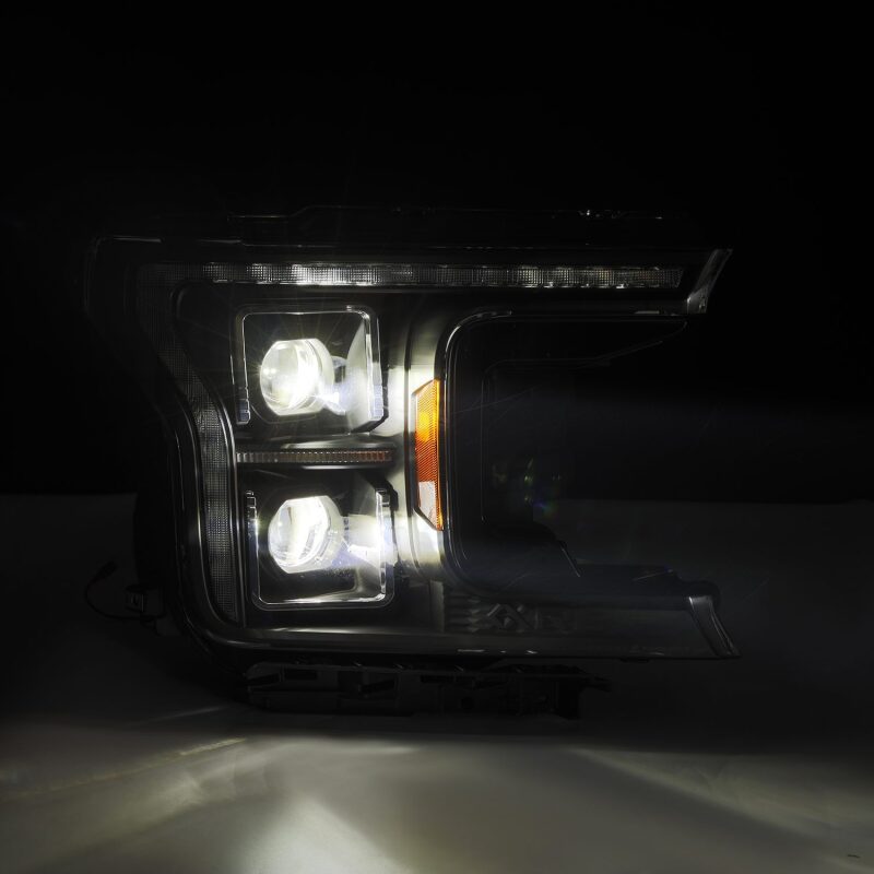 AlphaRex LUXX LED projector headlights for 2018-2020 Ford F-150, featuring black housing and sequential signal lights.