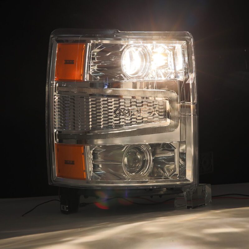 AlphaRex 14-15 Chevy 1500 PRO-Series projector headlights with chrome finish, sequential signal, and daytime running lights.