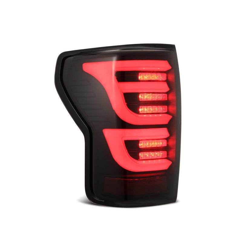 AlphaRex LUXX-Series LED tail light for 2007-2013 Toyota Tundra in black, featuring a modern design with bright red LEDs.