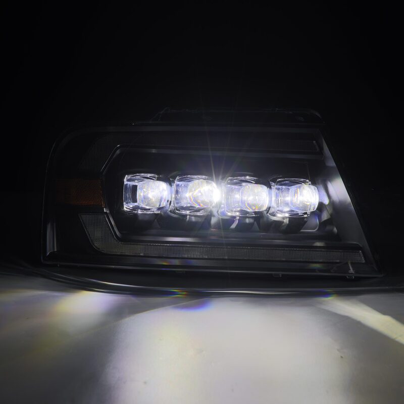 AlphaRex NOVA-Series LED projector headlights for 2004-2008 Ford F-150, featuring black housing and sequential signals.