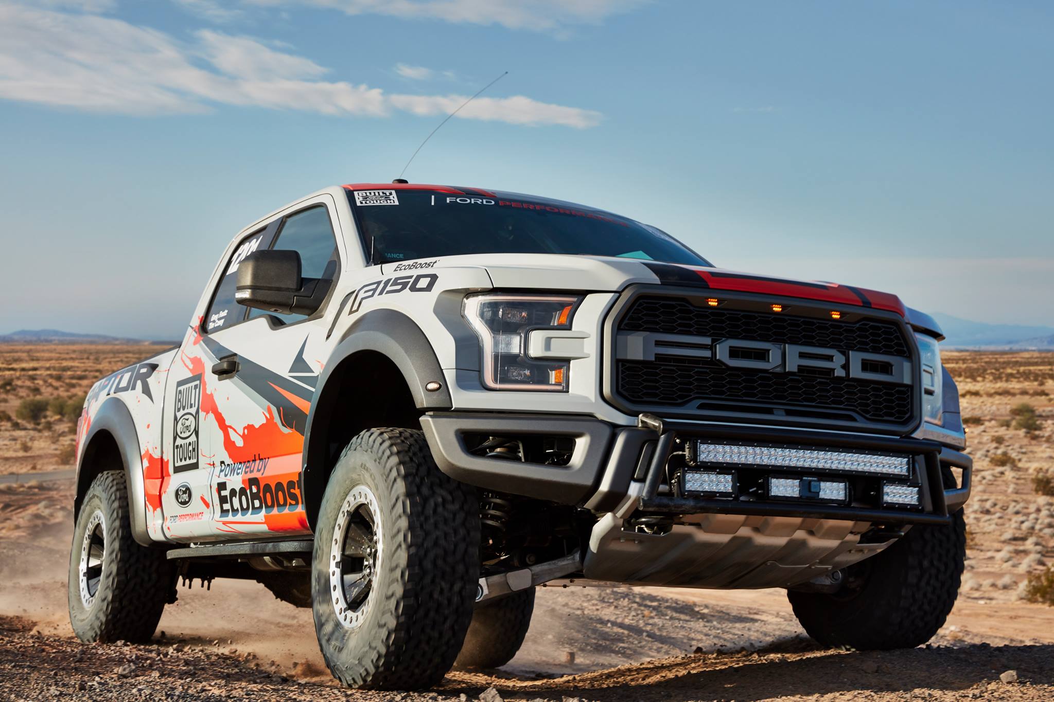 Front view of a 2017-2020 Ford Raptor equipped with a race truck front bumper light bar mount kit, showcasing offroad capabilities.