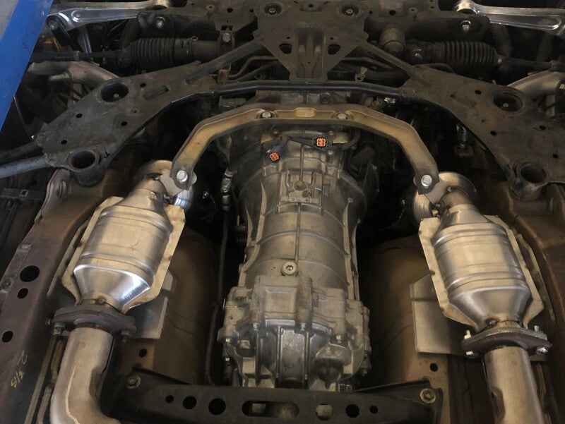 Direct fit catalytic converter for Nissan 350Z 03-06 V6-3.5L installed, showcasing exhaust system components and layout.