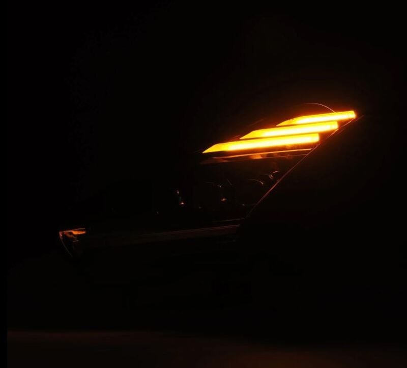 AlphaRex NOVA-Series LED projector headlights for 2009-2024 Nissan GT-R with a sleek design and bright amber turn signal.