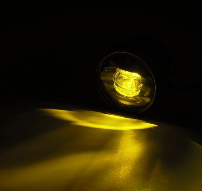 AlphaRex DoubleTap dual color LED fog light projecting amber light, designed for Chrysler, Dodge, Hummer, and Jeep vehicles.