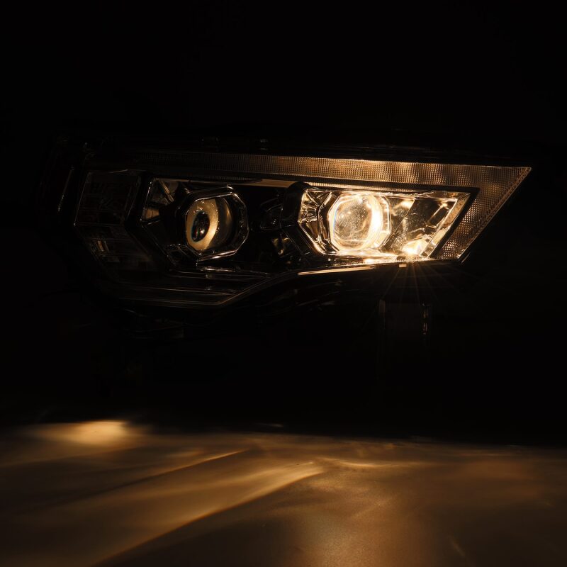 AlphaRex 14-22 Toyota 4Runner PRO-Series projector headlights in black with sequential signal and daytime running lights.
