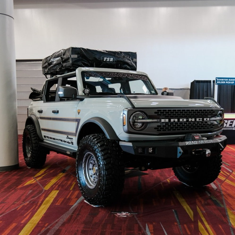 2021-2025 Ford Bronco with a heat extractor hood, showcasing offroad capabilities and rugged design.