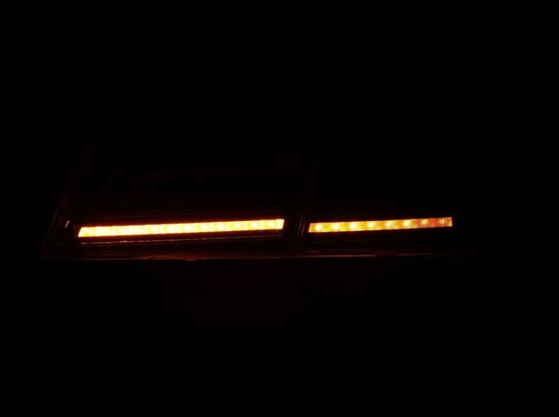 AlphaRex LUXX-Series LED tail lights for 12-21 Tesla Model S in black and red, showcasing bright LED illumination.