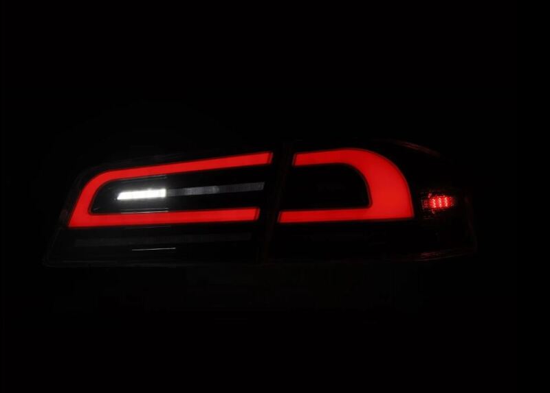 AlphaRex LUXX-Series LED tail lights for 12-21 Tesla Model S in black and red, showcasing a sleek, modern design.