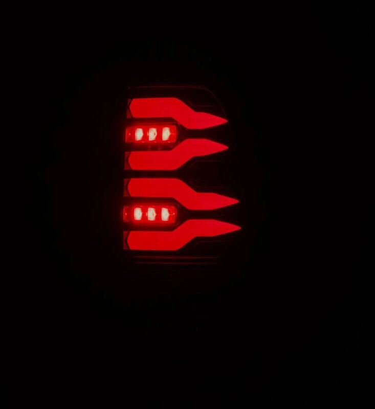 AlphaRex LUXX-Series LED tail lights for 97-03 Ford F150 and 99-16 Ford Super Duty in black and red design.