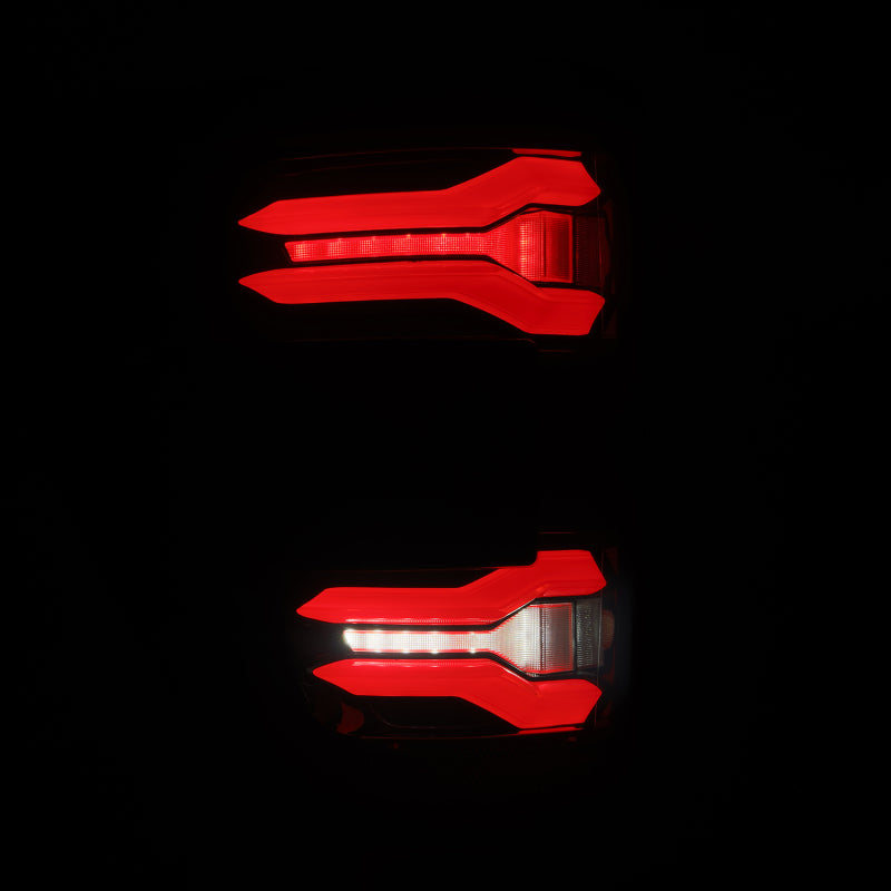 AlphaRex LUXX LED taillights for 21-23 Ford F-150 in black and red with BLIS feature, showcasing modern design and bright illumination.