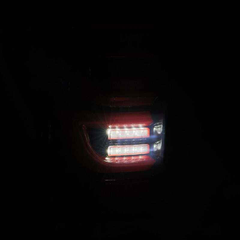 AlphaRex LUXX-Series LED tail lights for 07-13 Toyota Tundra in black and red, showcasing bright illumination and modern design.