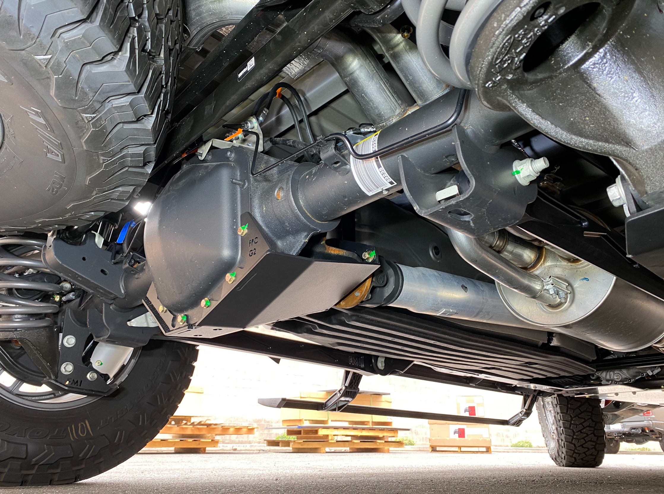 2017-2024 Raptor rear differential skid plate kit installed, showcasing protection for offroad performance and durability.