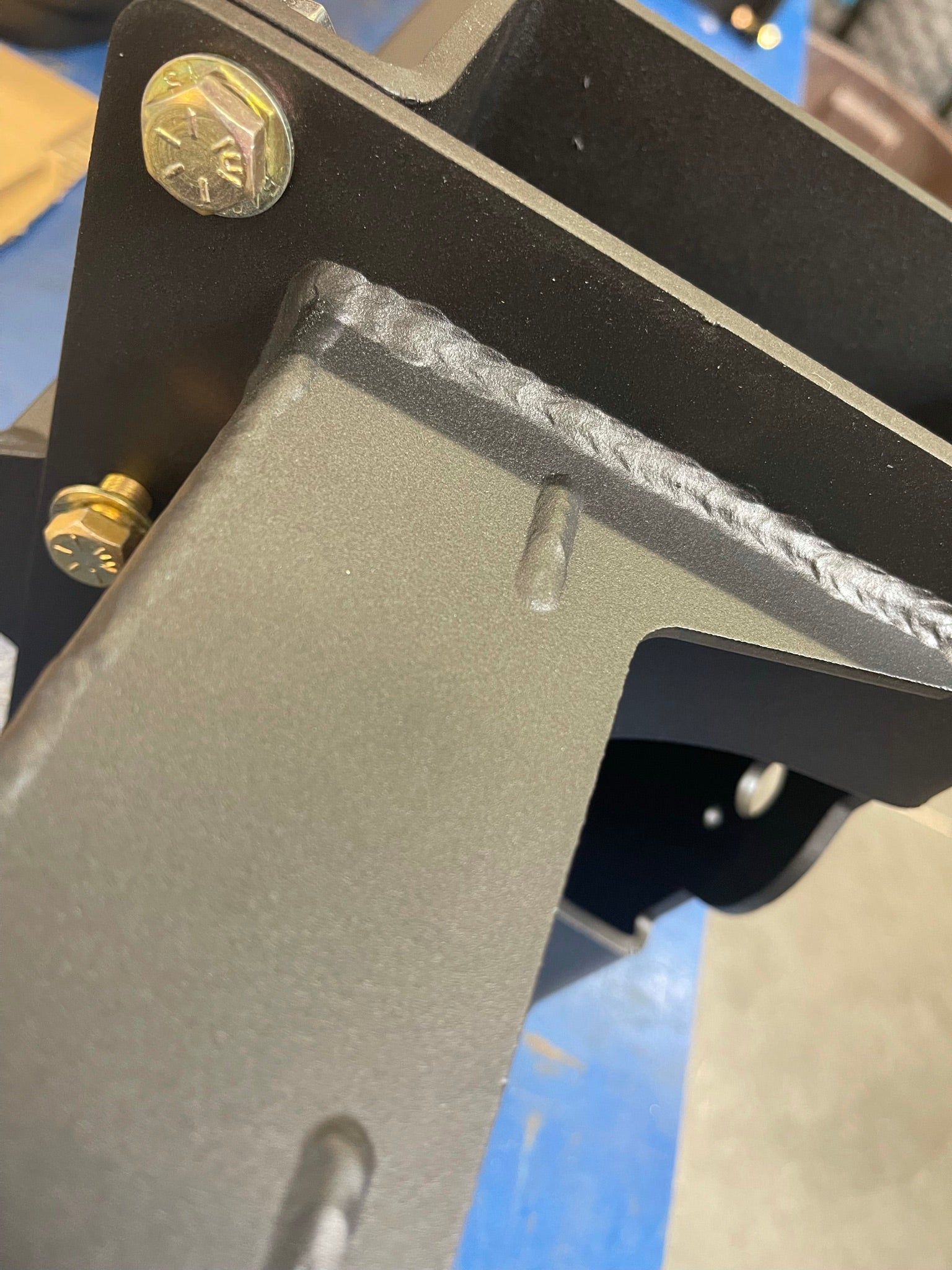 Close-up of the rear bump stop kit for 2017-2020 Raptor and 2015-2024 F150, showcasing durable metal construction and welds.