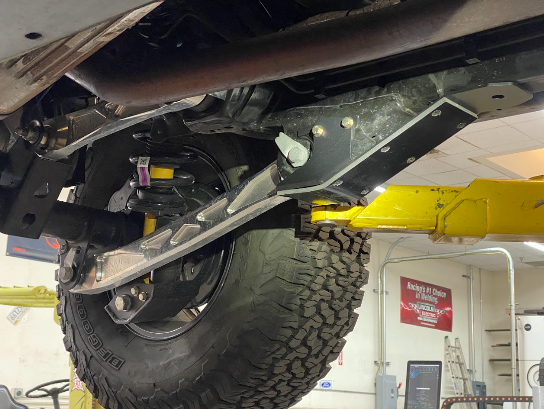 2021 and up Bronco rear lower arm frame guard with HDPE slide installed, showcasing rugged protection and offroad capability.