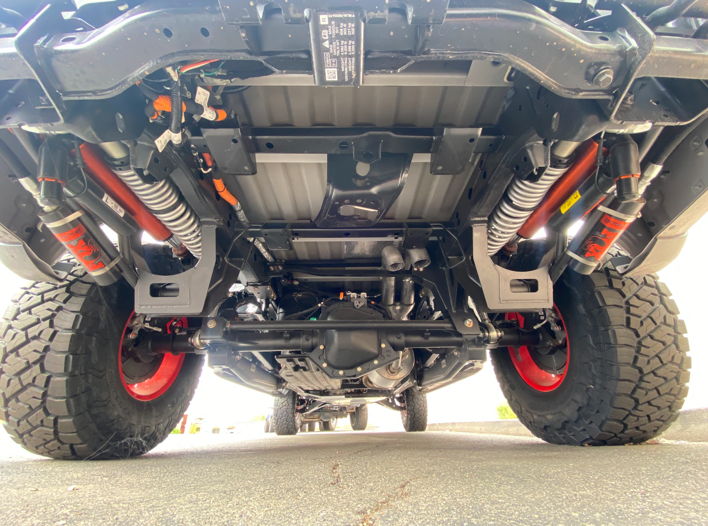 2021-2024 Raptor long travel rear suspension kit showcasing 19 inches of travel and robust components for enhanced off-road performance.