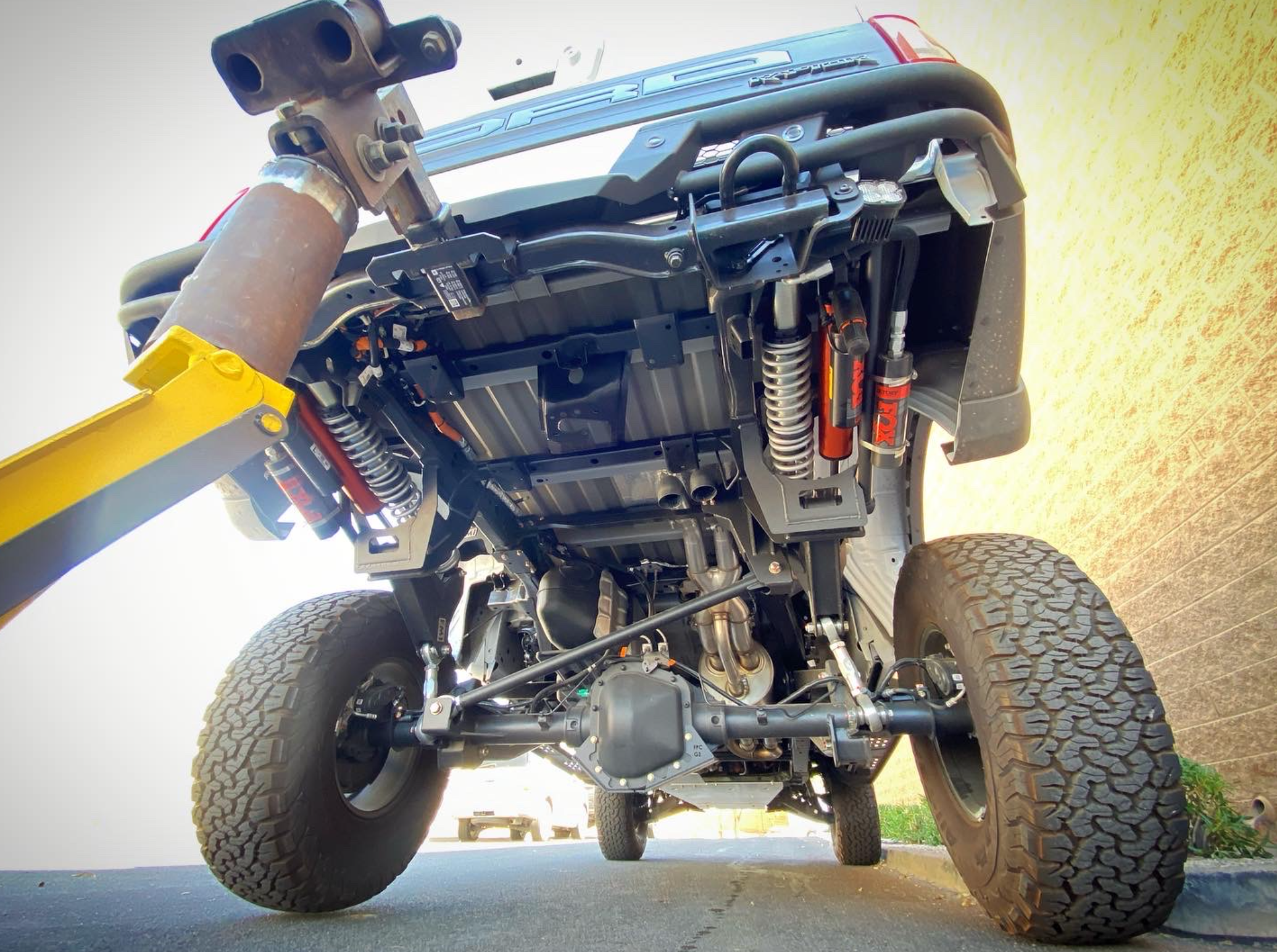 2021-2024 Raptor Long Travel Rear Suspension Kit showcasing 19 inches of travel, installed on a Gen 3 Raptor.