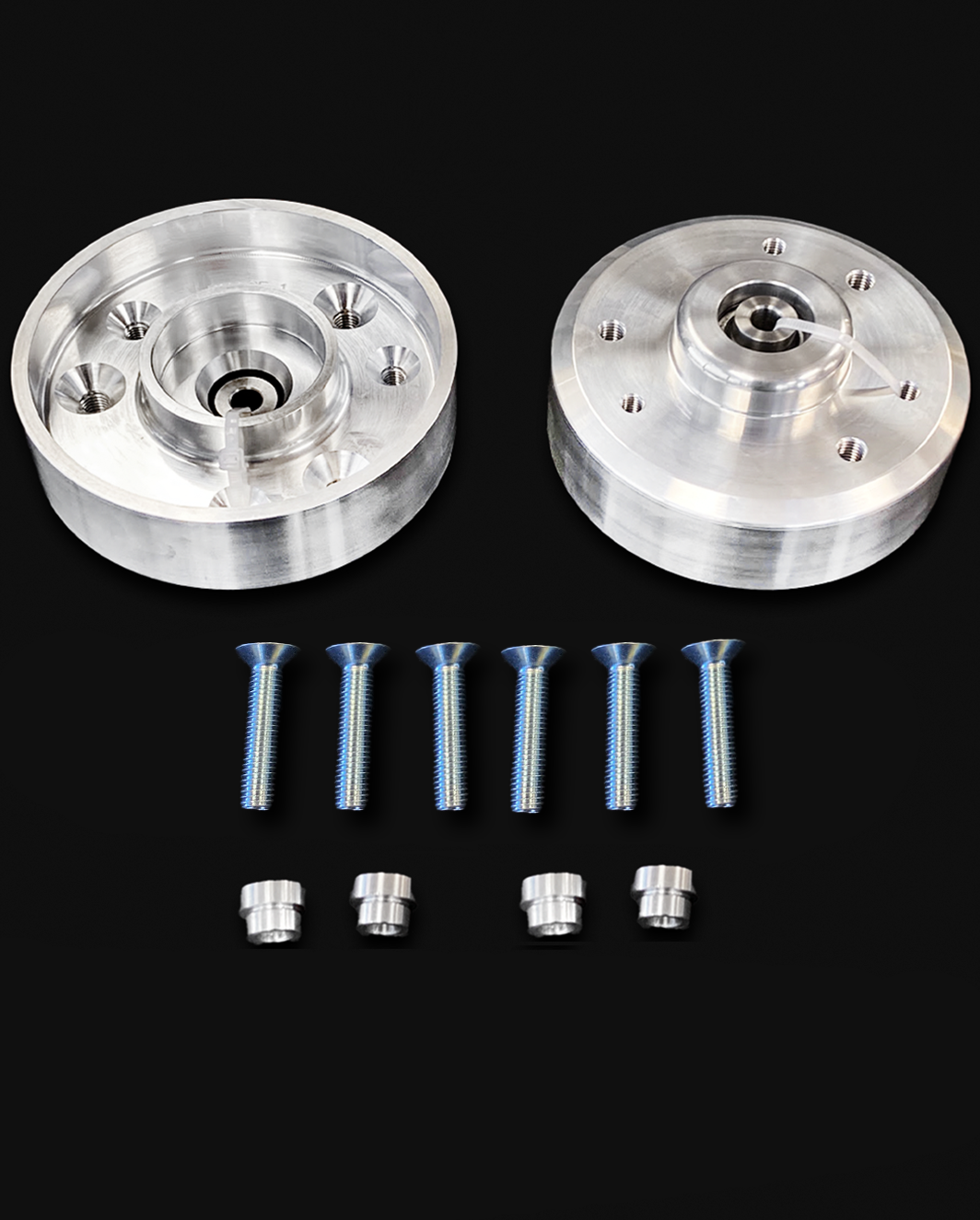 Billet top hat lift kit for 2024-Up Raptor, includes two lift hats and hardware for stock shock installation.