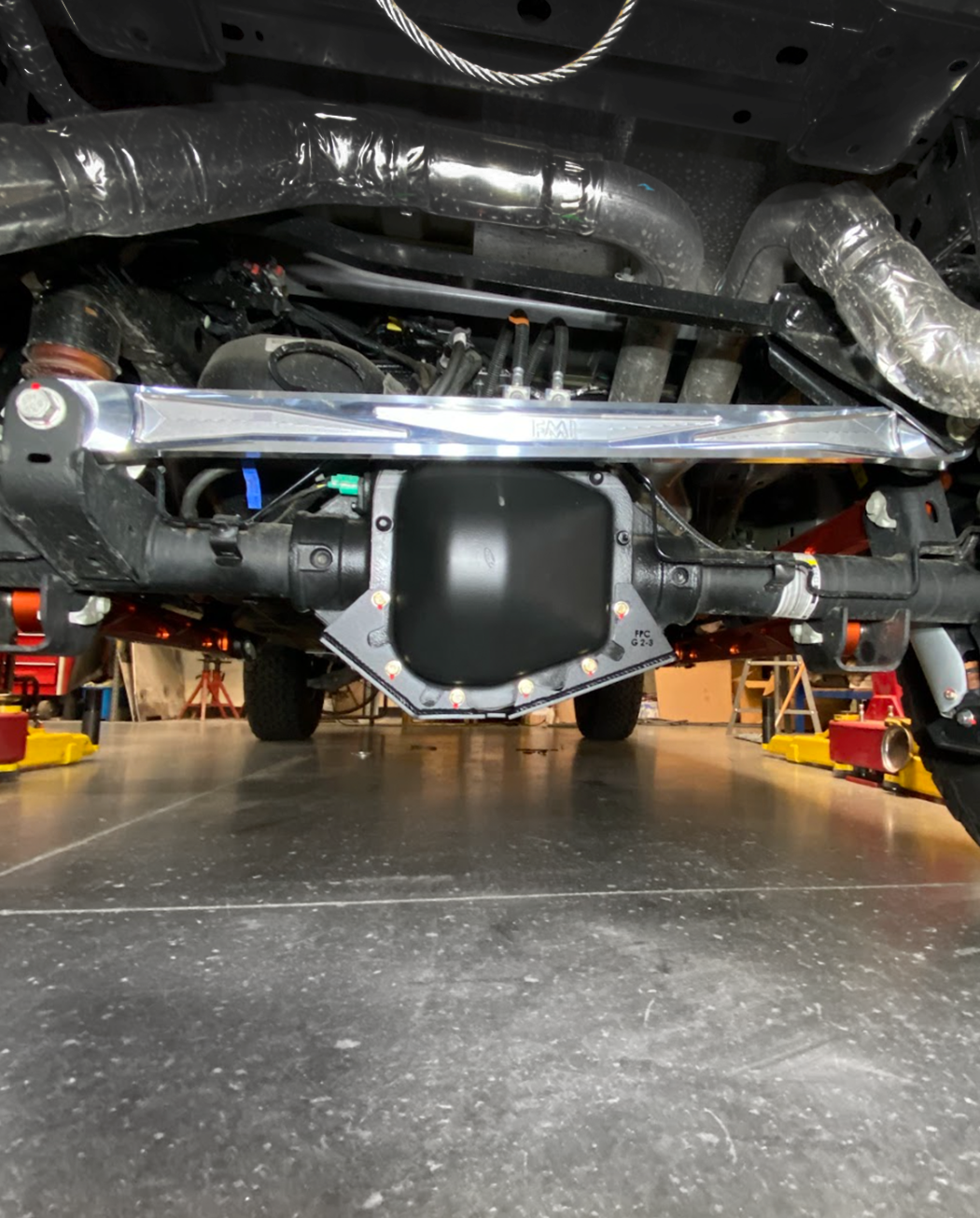 2021-2024 F150 Raptor billet panhard bar featuring an ultra-flex joint, showcasing durable construction for enhanced performance.
