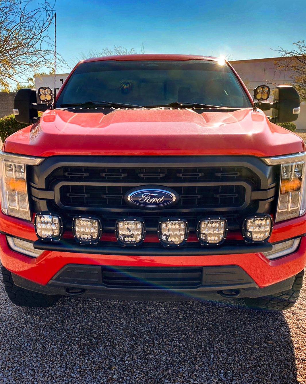 Front view of a 2021-2023 Ford F150 with a front light mount installed on the stock bumper, showcasing multiple LED lights.