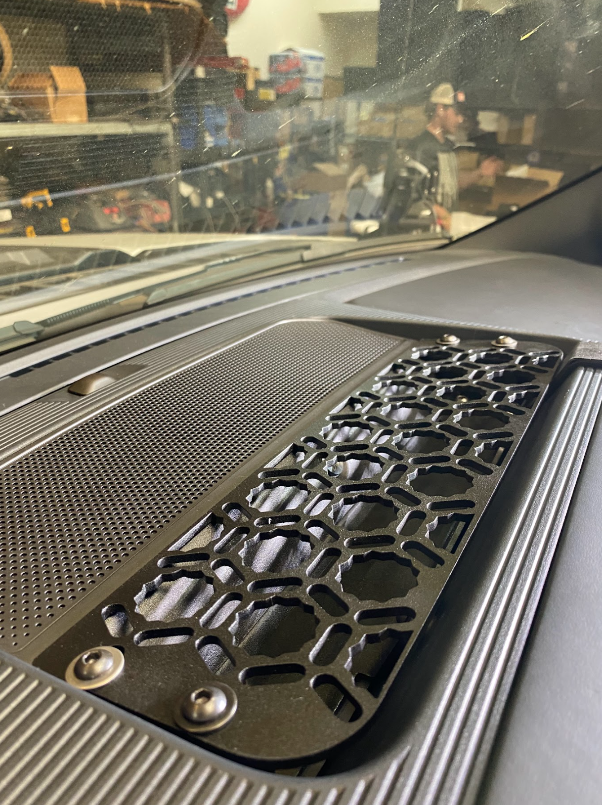 2024 F150 Raptor center dash mount kit by Adapt-A-Panel showcasing a textured surface and honeycomb design for enhanced functionality.