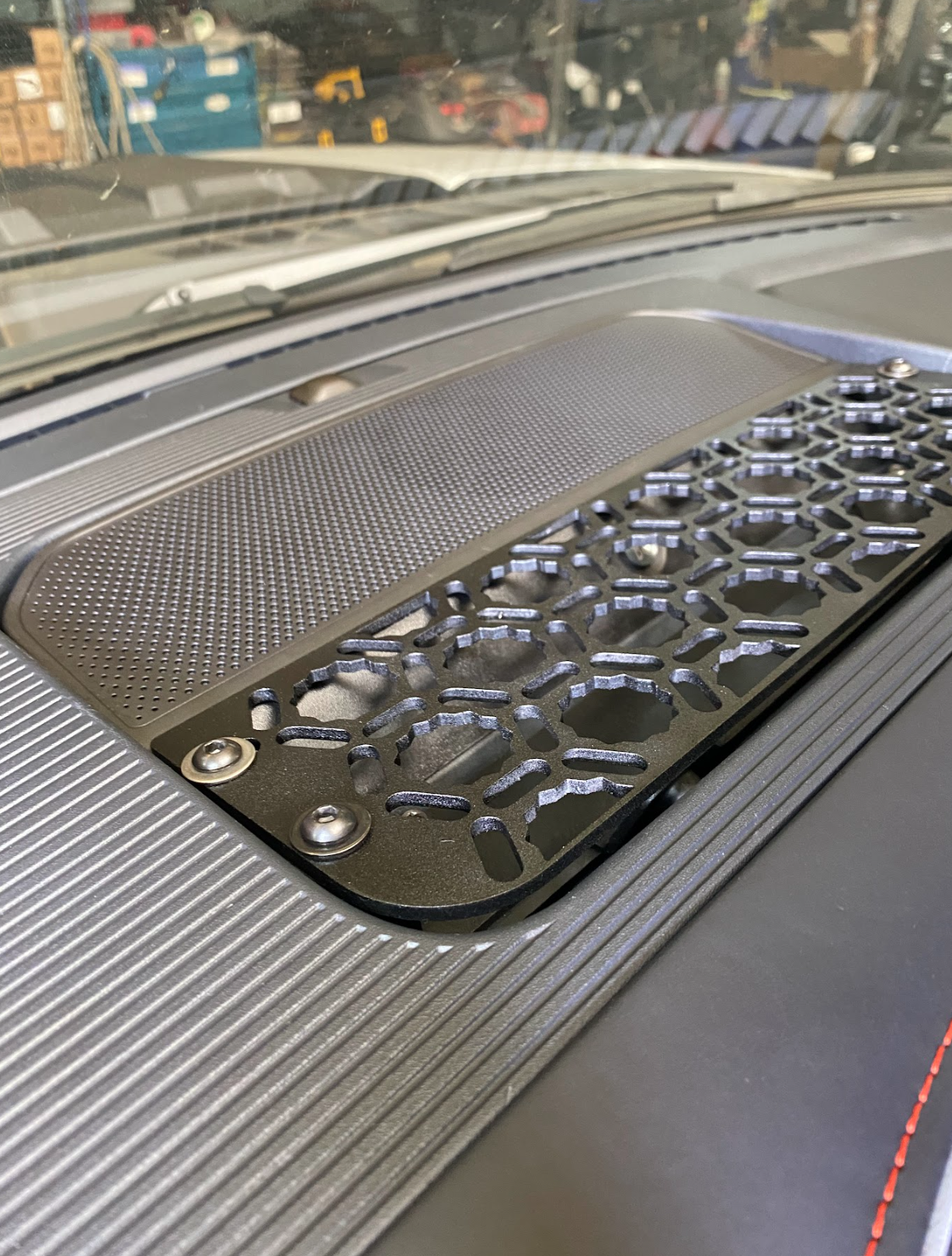 Center dash mount kit for 2024 F150 Raptor by Adapt-A-Panel, featuring a textured surface and secure fastening points.