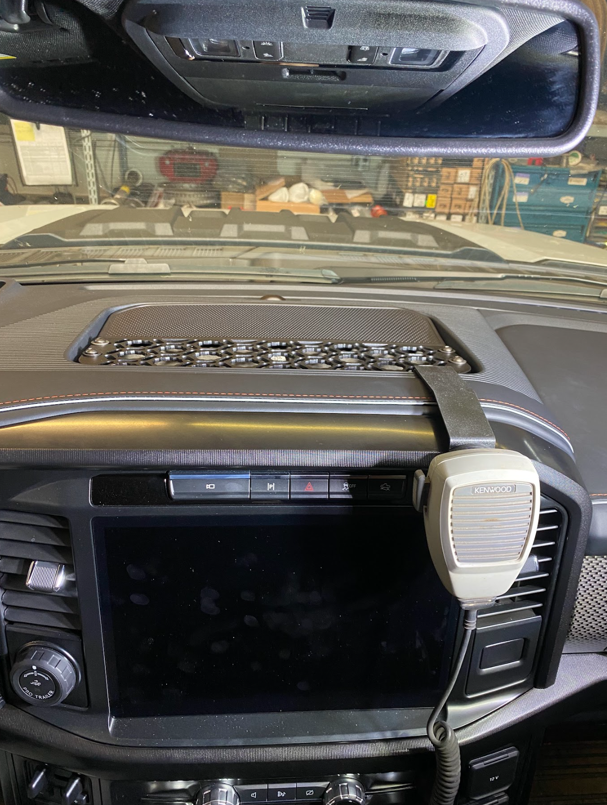 Center dash mount kit for 2024 F150 Raptor, featuring a sleek design and integrated space for communication devices.
