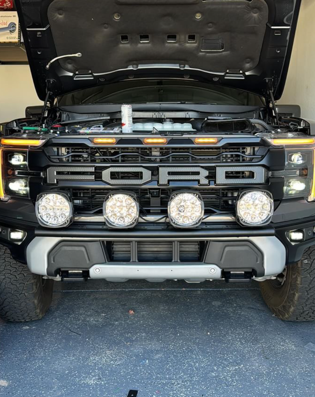 2024 Raptor front light mount kit installed on a truck, showcasing a modular bumper with multiple light options.