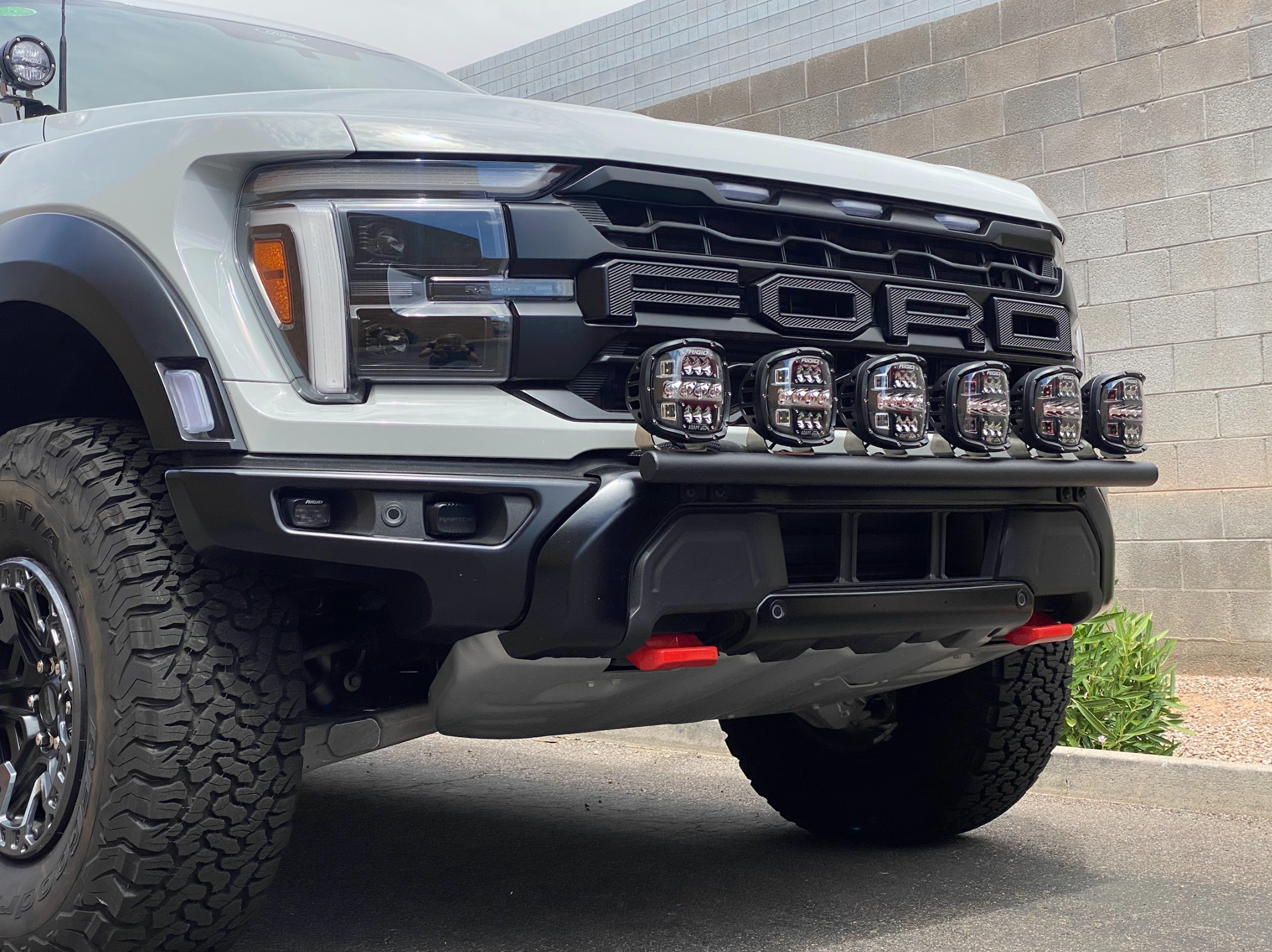 2024 Raptor front light mount kit on a truck, showcasing modular bumper design with multiple light options.