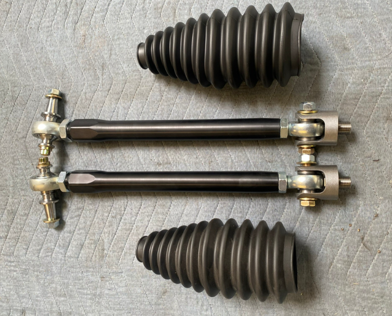2024 Ranger Raptor Billet Tie Rod Kit featuring two tie rods and two protective boots for enhanced durability and performance.