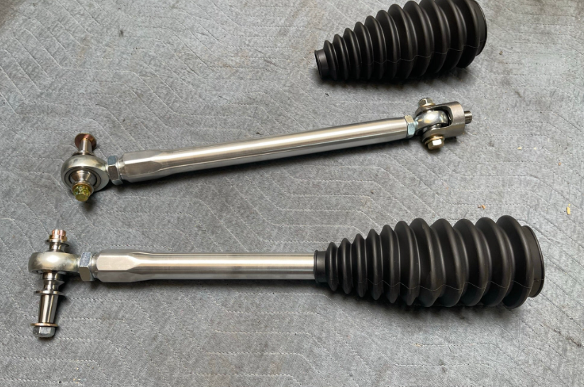 2024 Ranger Raptor Billet Tie Rod Kit featuring durable metal rods and protective rubber boots for enhanced offroad performance.