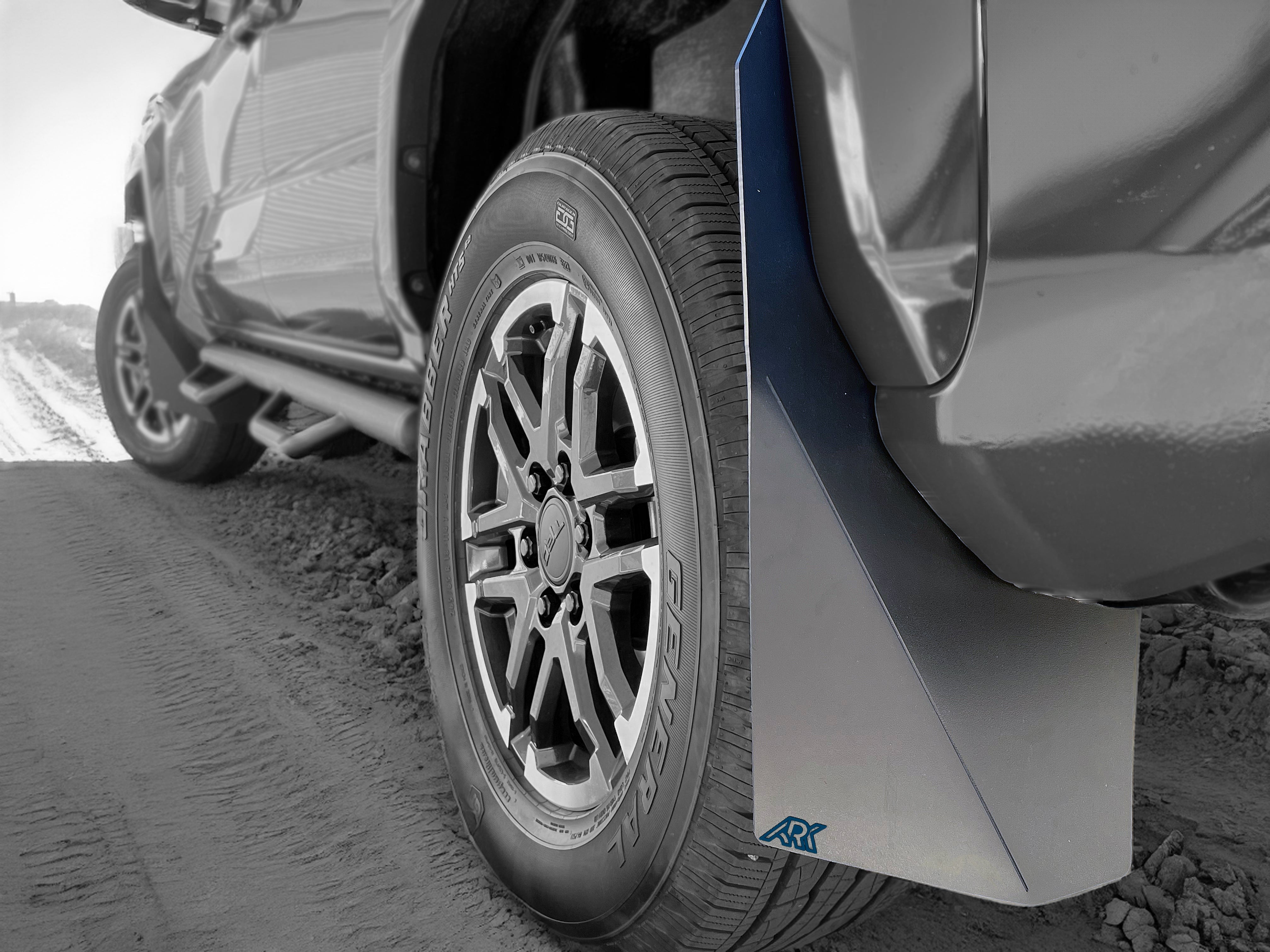 2024+ Toyota Tacoma TriXpoly splash guards and mudflaps installed on a truck, providing protection from mud and debris.