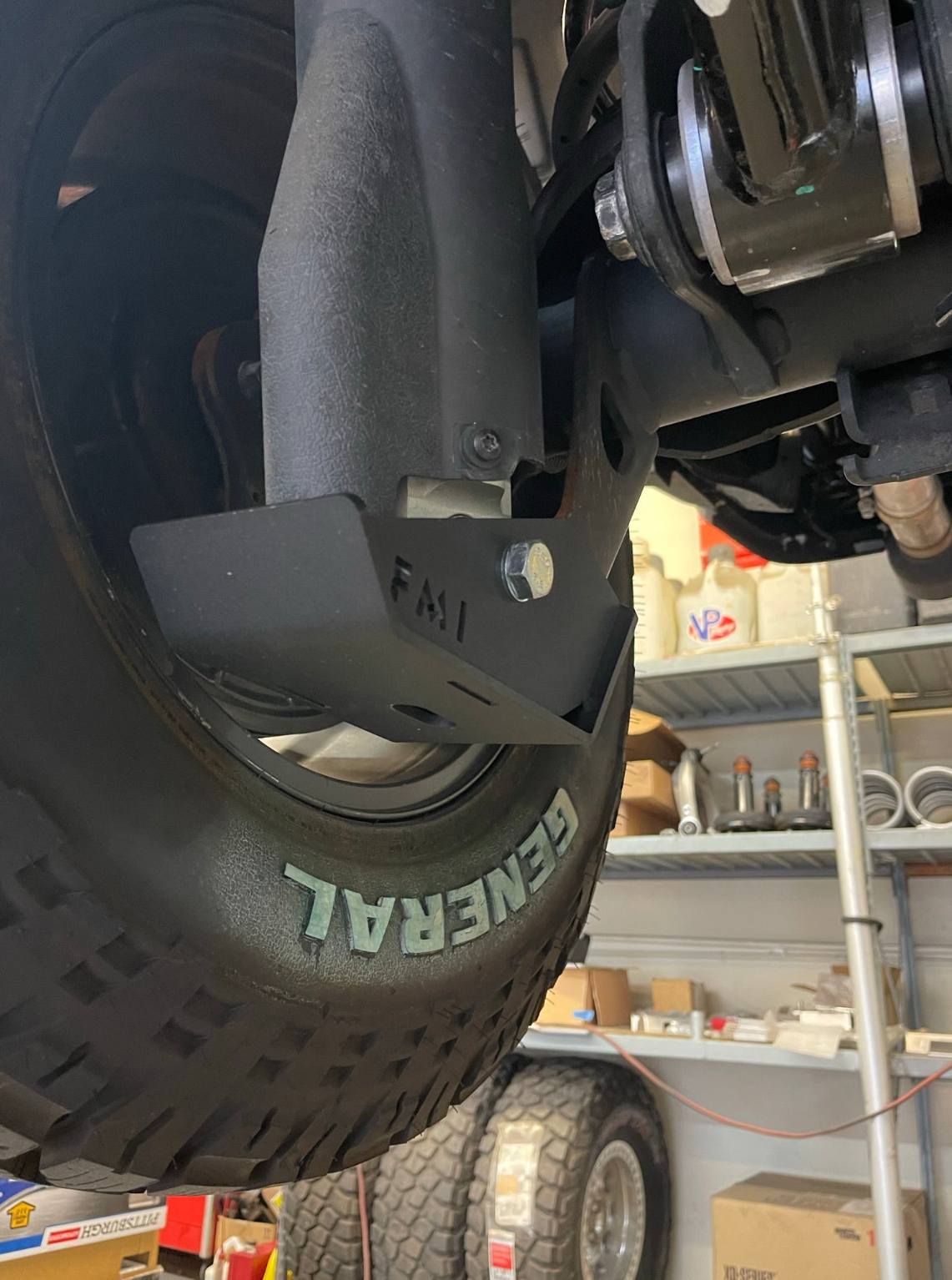 2025 Ram RHO Rear Shock Skid Kit installed on a vehicle, showcasing durable protection for offroad shocks.
