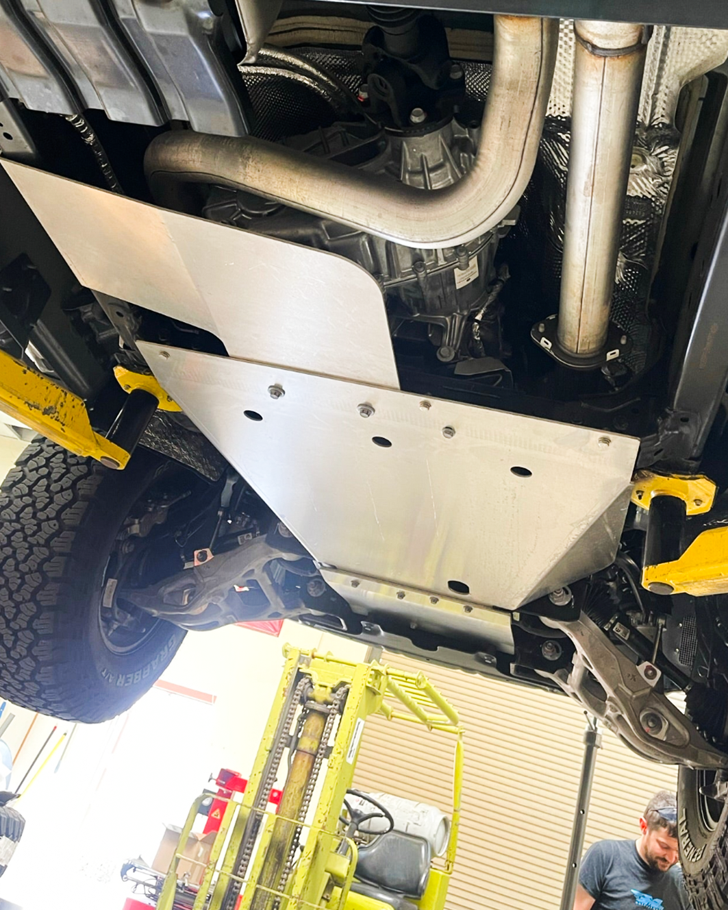 Underbody view of a 2025 Ram RHO skid plate kit installed, showcasing durable protection for offroad adventures.