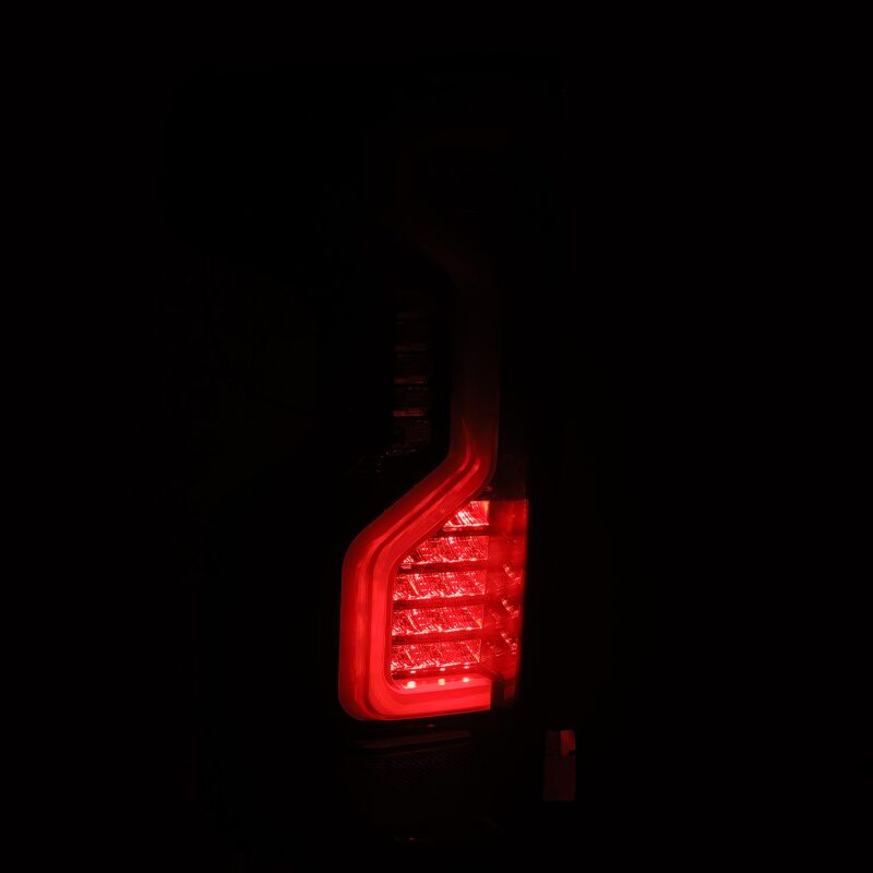 AlphaRex PRO-Series LED tail light for 2019-2023 Chevrolet Silverado models, featuring a sleek jet black design and bright red illumination.