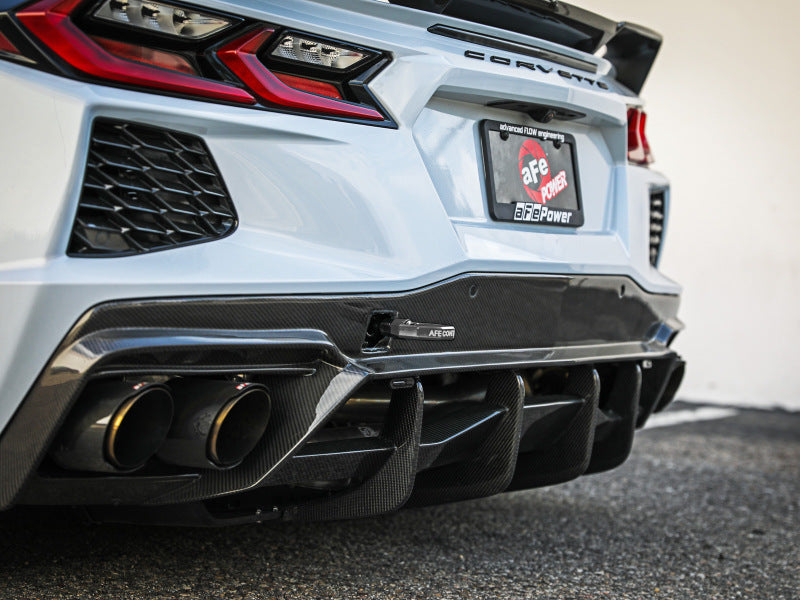 aFe CONTROL Tow Hook for Chevrolet Corvette C8 2020-2025, showcasing a sleek rear design with carbon fiber accents and dual exhaust.