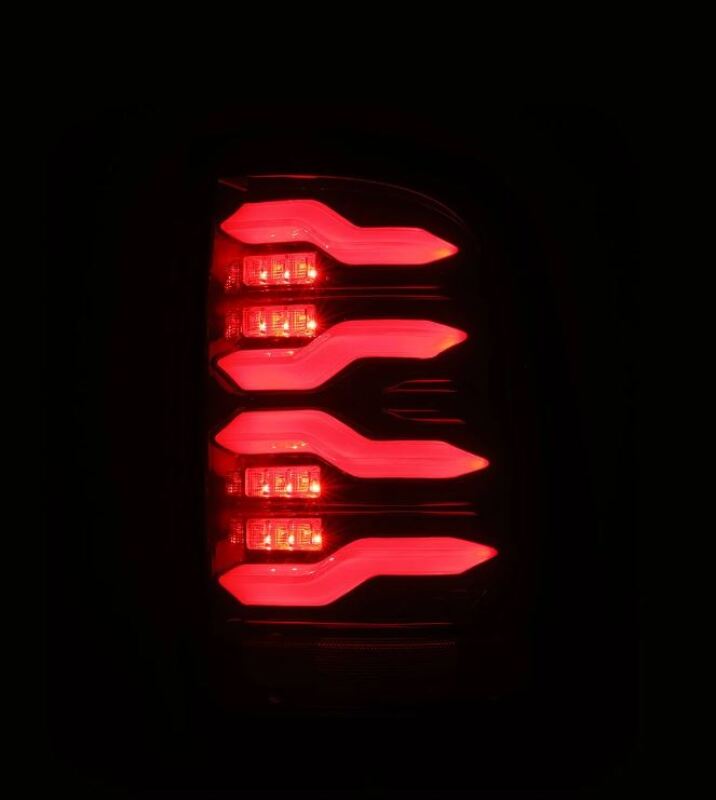 AlphaRex LUXX-Series LED taillights for 09-18 Dodge RAM in black and red with active lighting features.