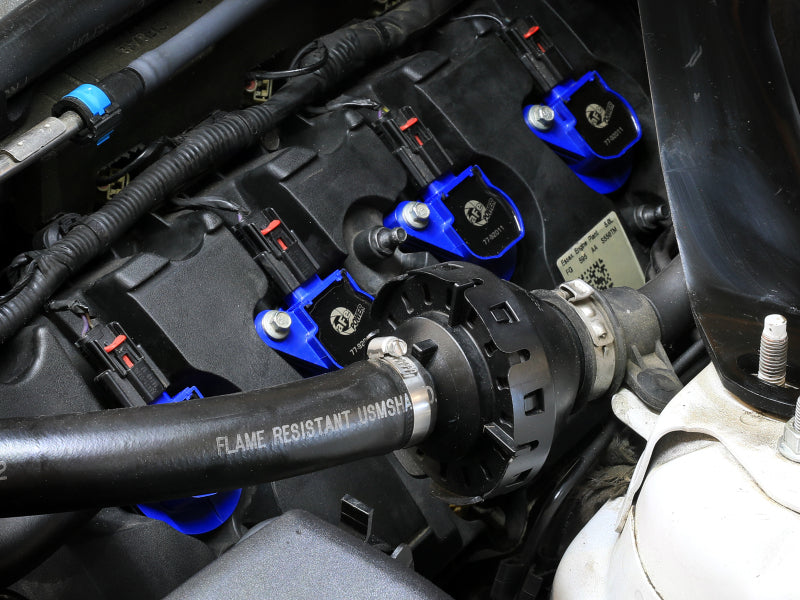 afe SCORCHER ignition coils installed in a Ford Mustang engine, enhancing performance for V8-5.0L models from 2011 to 2016.