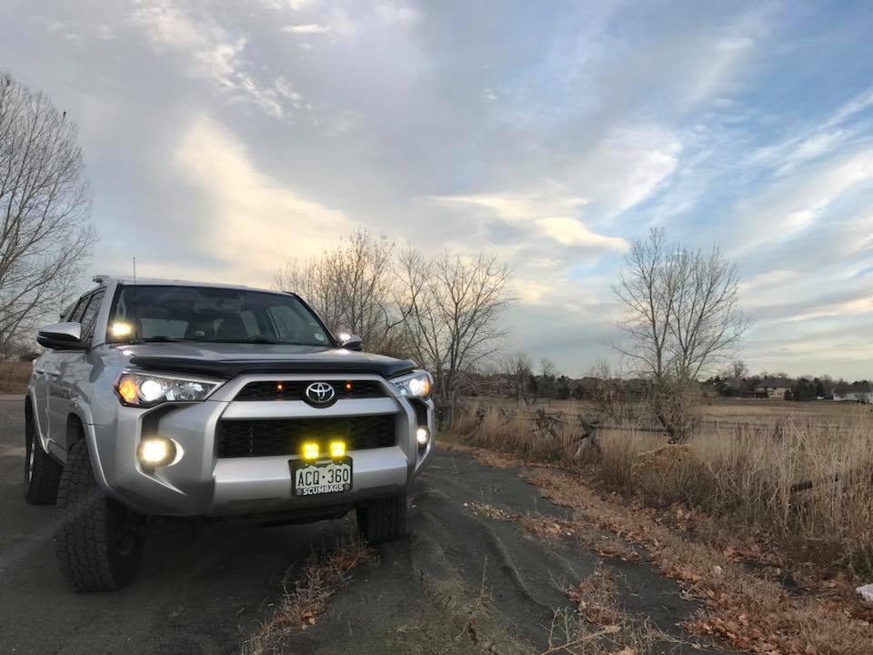 Baja Designs S2 Sport LED lights mounted on a Toyota 4Runner, enhancing visibility on an outdoor trail.