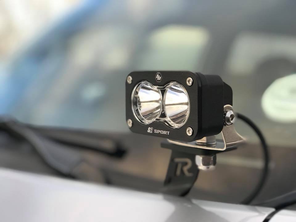Baja Designs S2 Sport Pair Driving/Combo LED lights mounted on a vehicle, showcasing their compact design and powerful illumination.