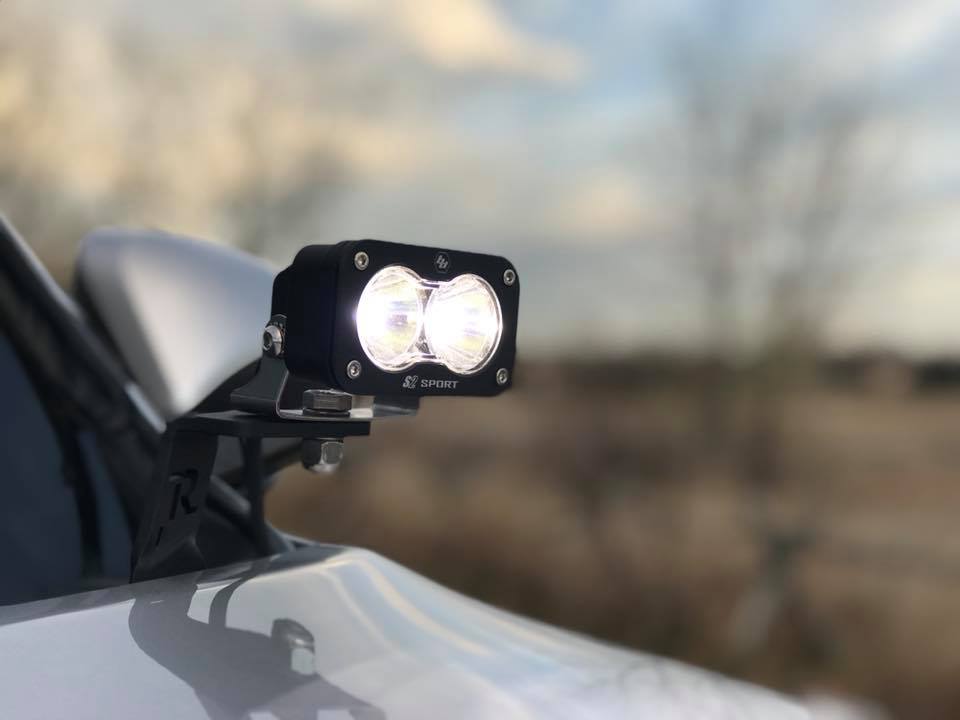 Baja Designs S2 Sport Pair Wide Cornering LED lights mounted on a vehicle, designed for enhanced visibility and offroad performance.