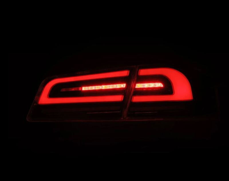 AlphaRex LUXX-Series LED tail lights for 12-21 Tesla Model S in black and red, showcasing a sleek, modern design.