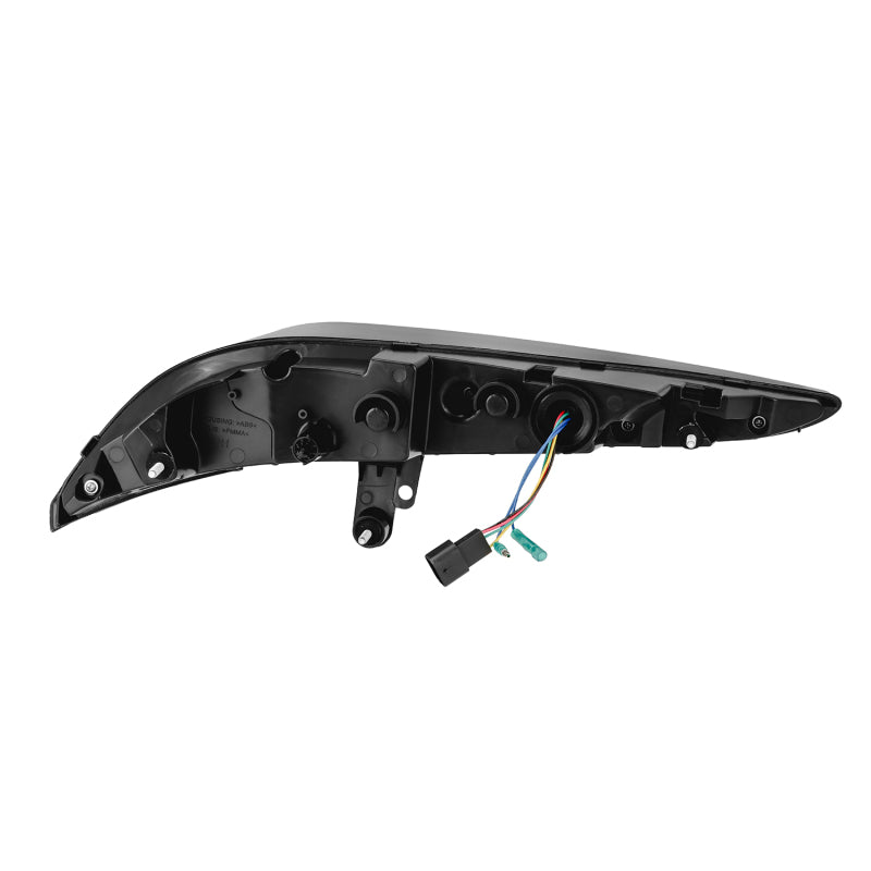 AlphaRex LUXX-Series LED tail light for 20-24 Toyota Supra in black, showcasing sleek design and wiring connections.