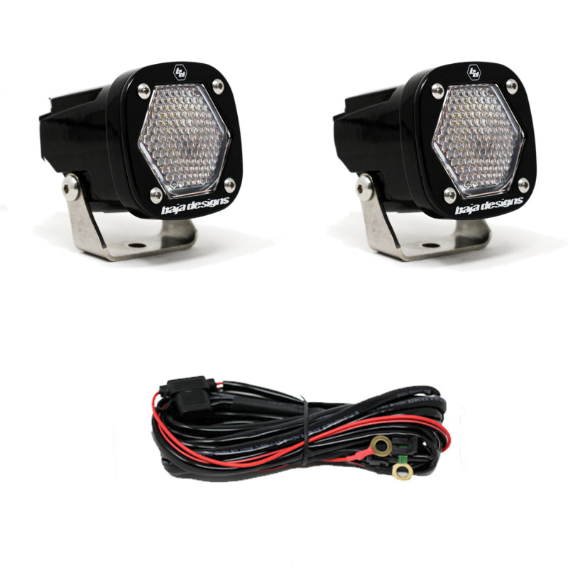 Baja Designs S1 Work/Scene LED light pair with mounting brackets and wiring harness for off-road vehicles.