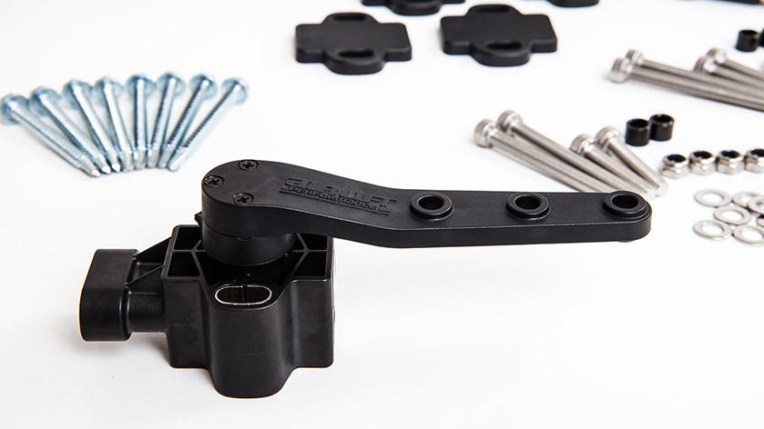 Air Lift 3H System 1/4" air line components, featuring a black control valve and assorted hardware for installation.