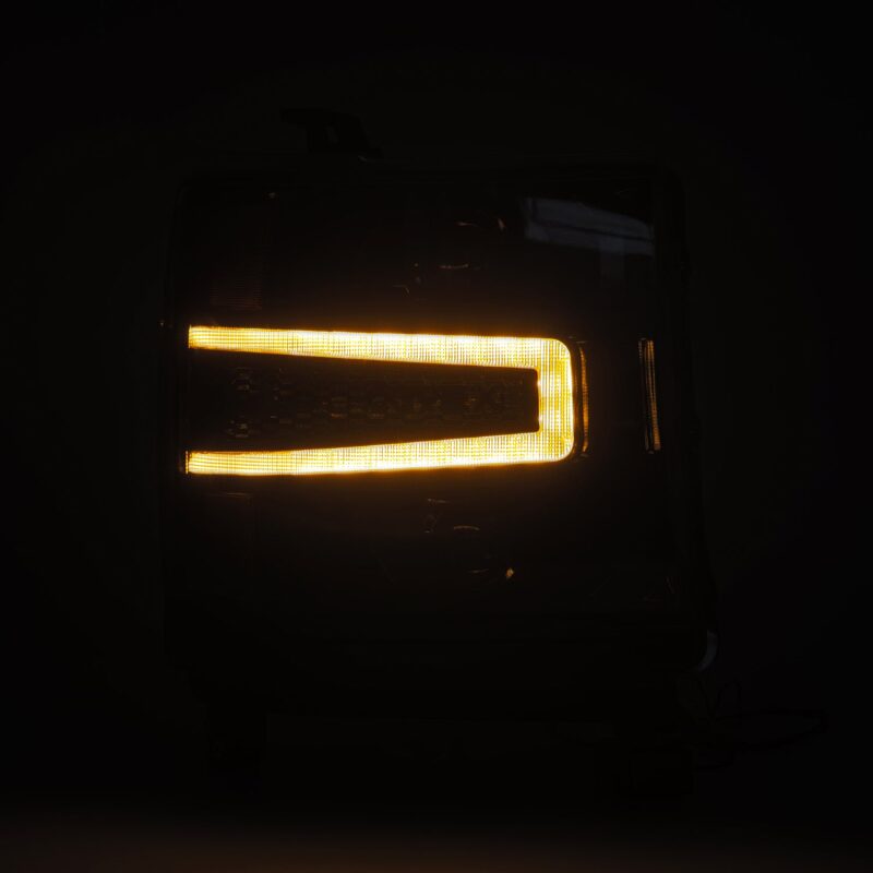 AlphaRex NOVA-Series LED projector headlights for 2016-2018 Chevy 1500HD featuring sequential signals and daytime running lights.