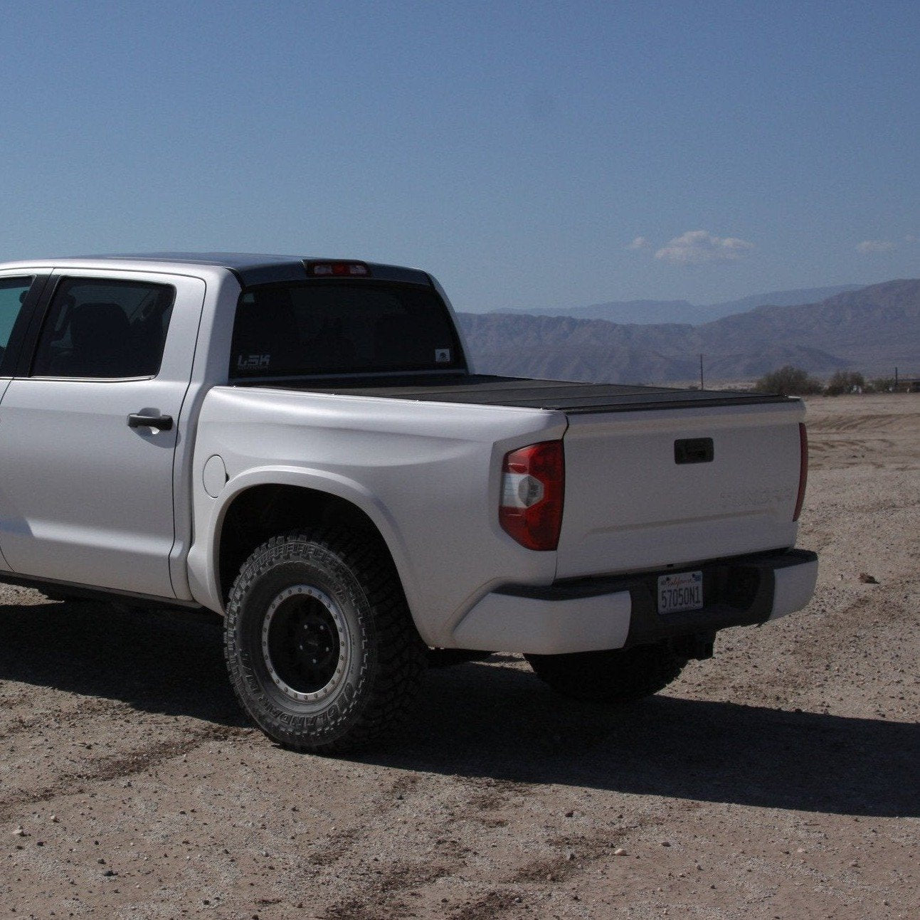 2014-2021 Toyota Tundra with aftermarket bedsides, showcasing a rugged design and off-road capabilities in a desert setting.